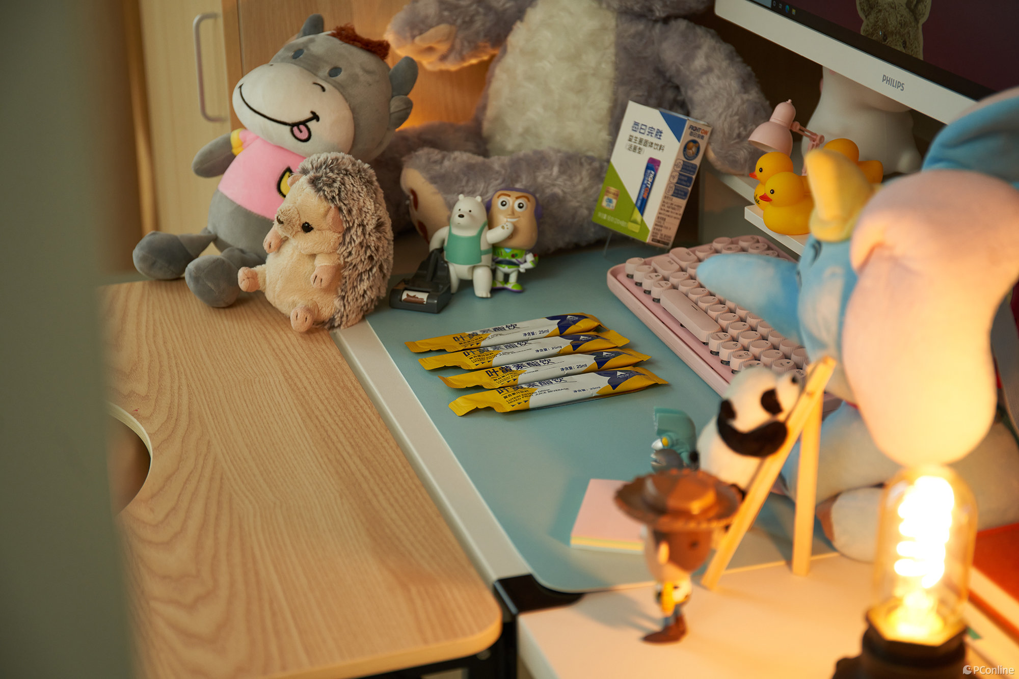 custom plush toy sitting on a desk as brand merchandise