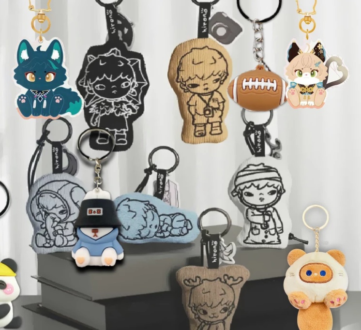 Collection of custom keychains made of acrylic, soft PVC, and fabric